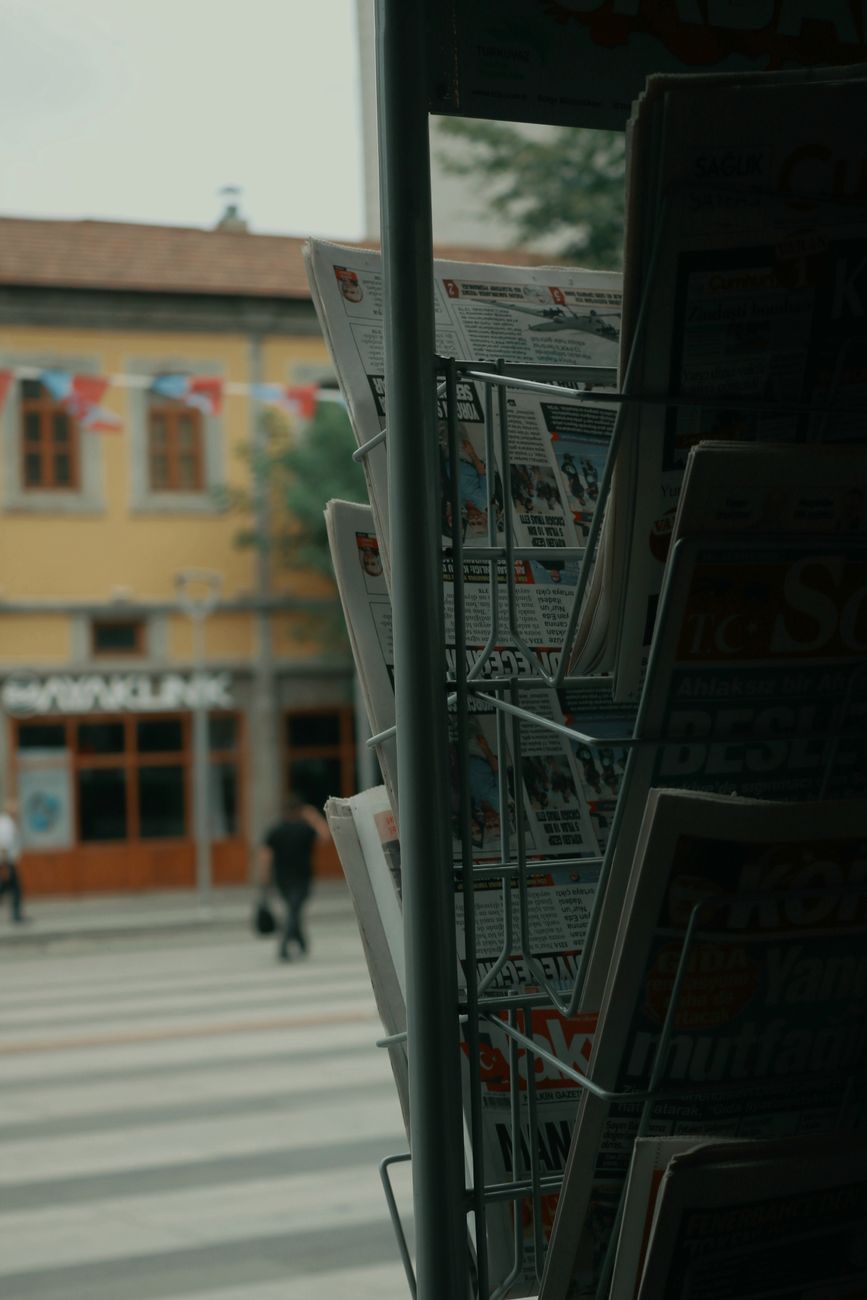 newspaper stand and the view of a street crossing in city
